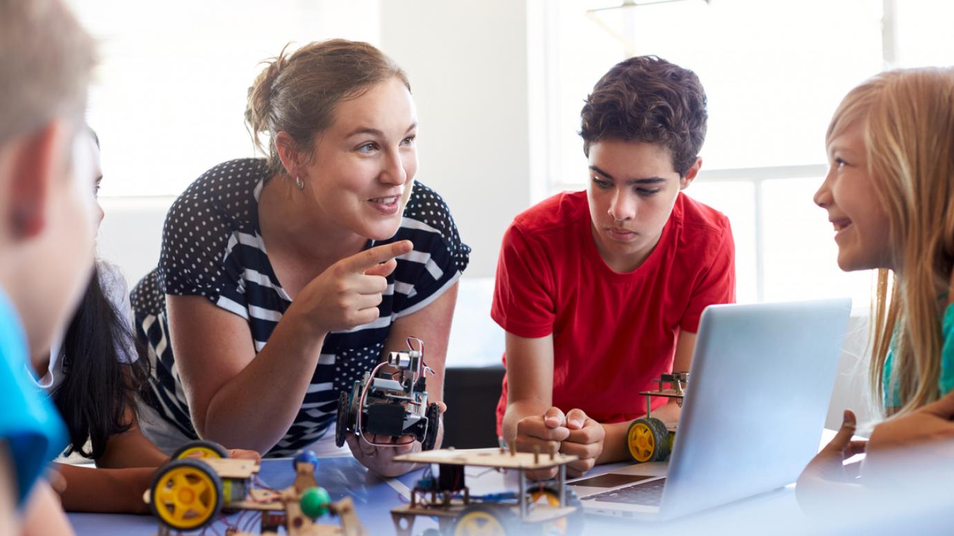 Students In After School Computer Coding Class Building And Learning To Program Robot Vehicle (istock - monkeybusinessimages)
