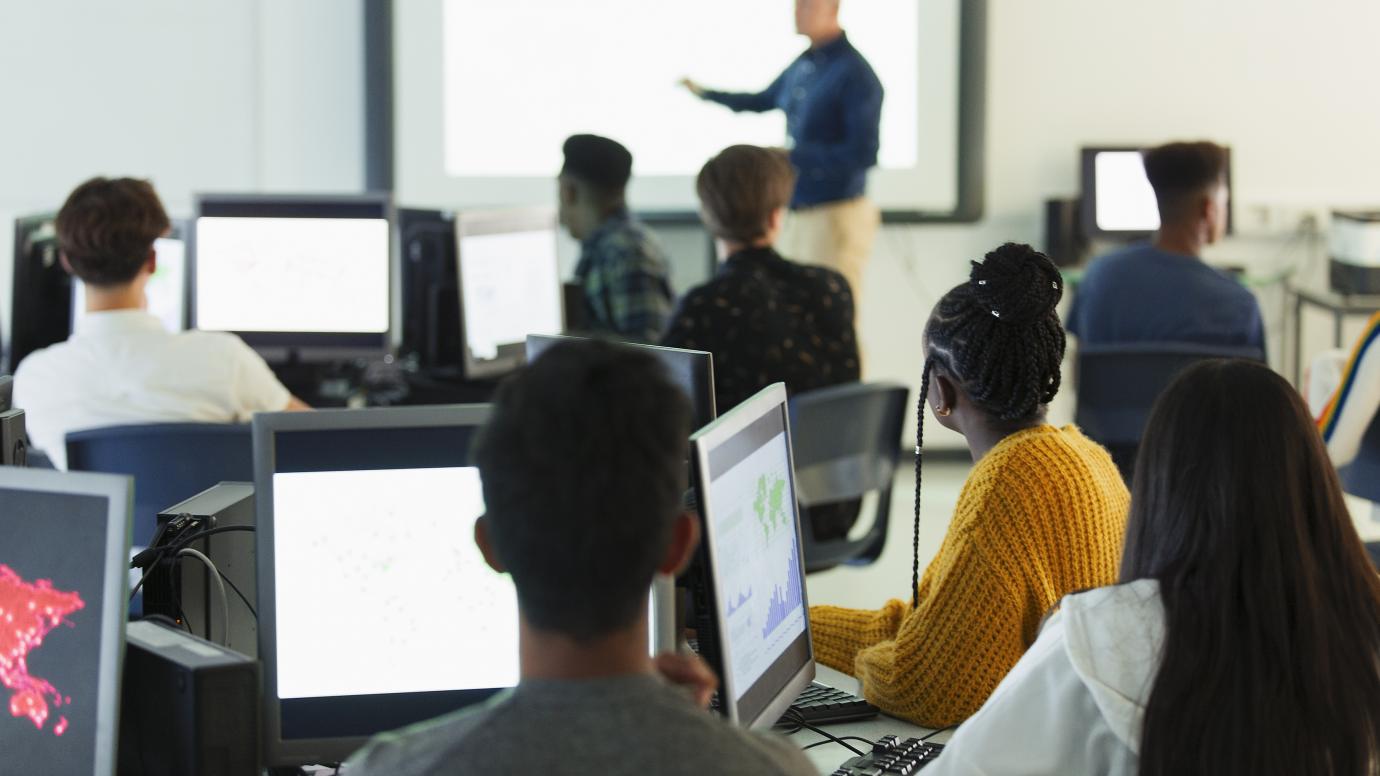 Group of diverse students attending and IT course 