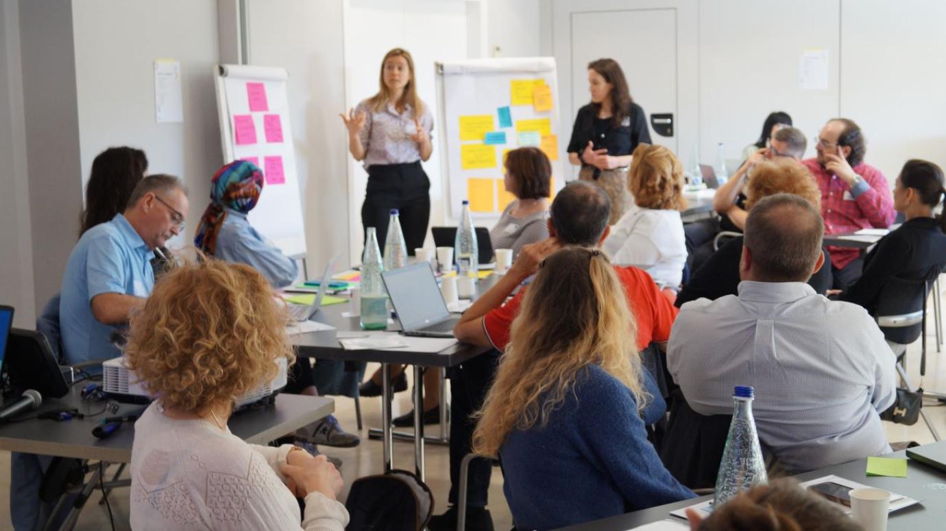 Participants of the Hub in a discussion