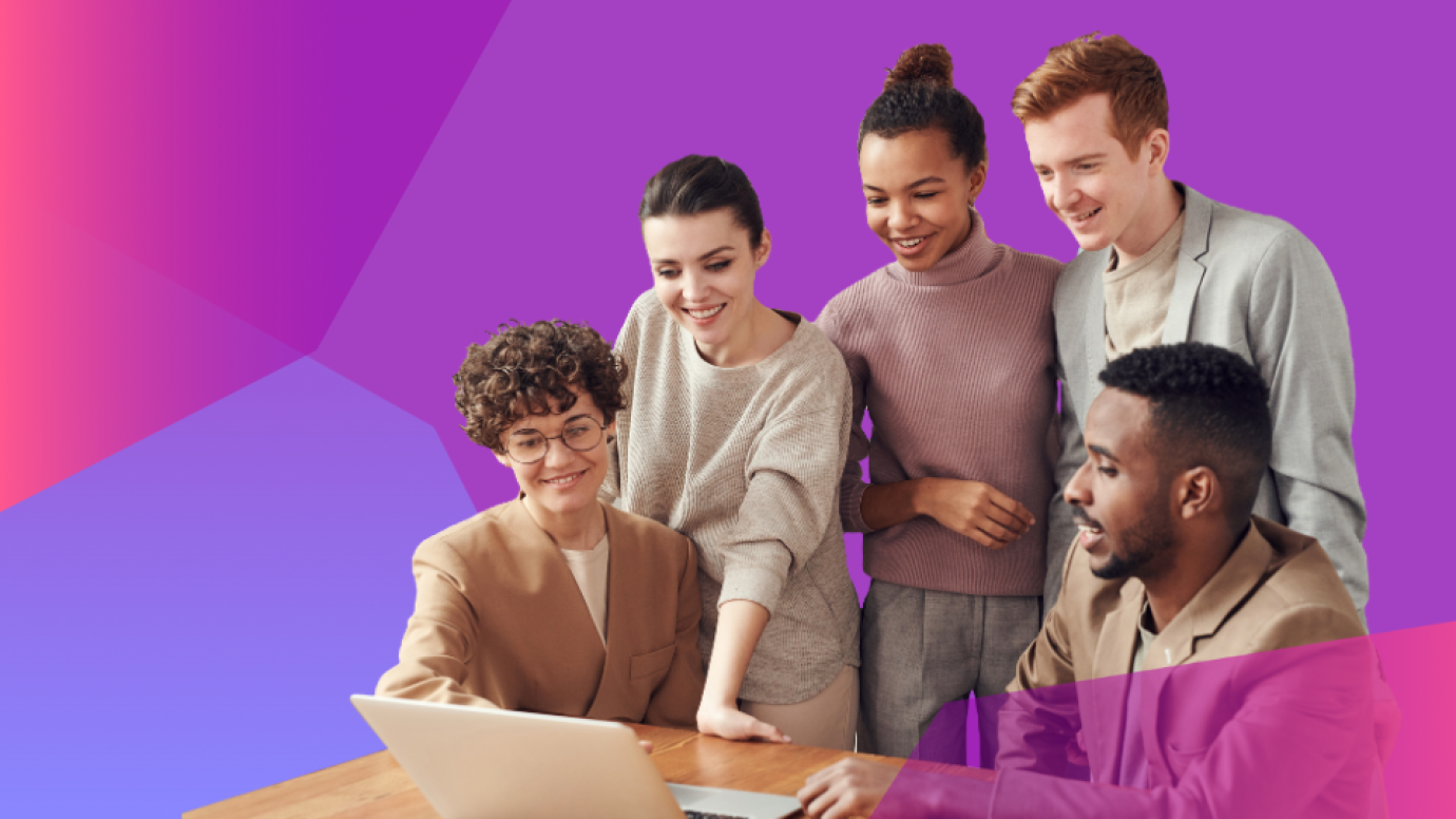 People gathered around a laptop