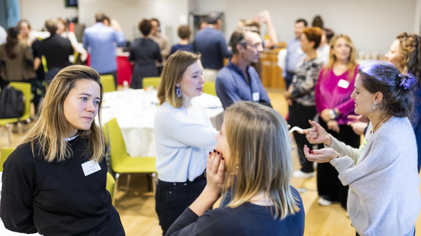 Group of people interacting with each other during a workshop