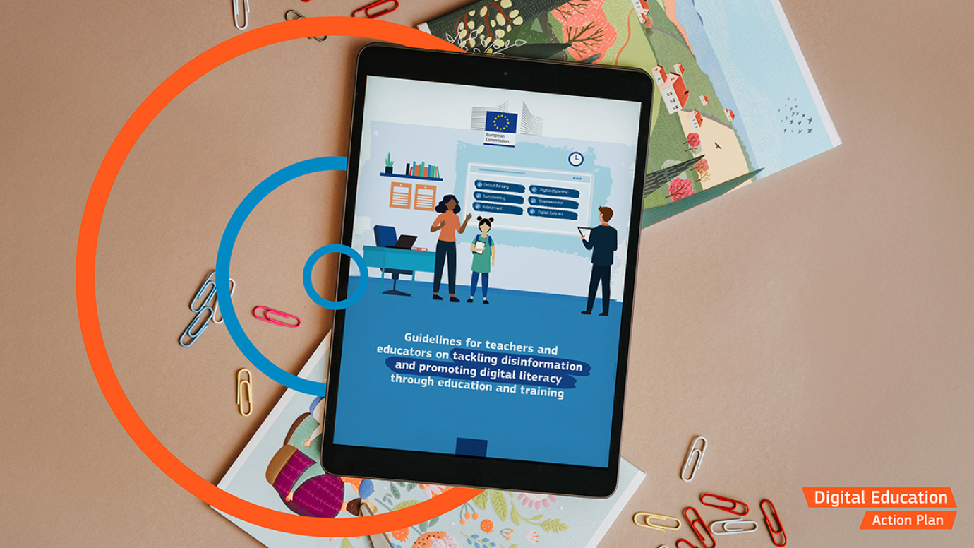 Illustration: a tablet with the cover image of the guidelines on tackling disinformation over a desk